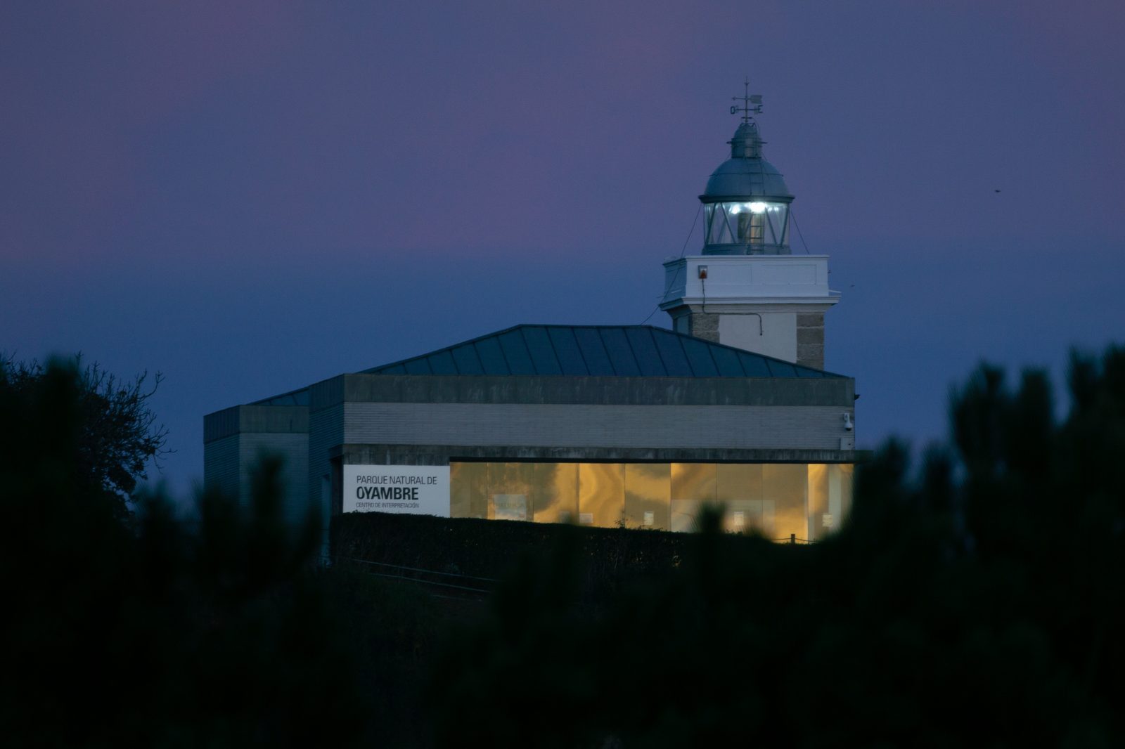 As twilight settles over Oyambre, the lighthouse glows like a steady heart, quietly guiding all who wander home.