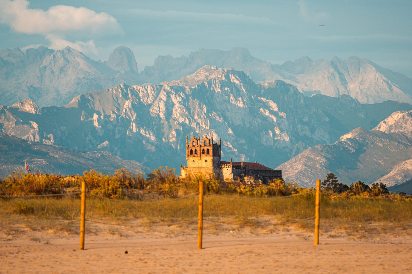 Between golden sand and ancient stone, the mountains stand like quiet witnesses to how far love can travel and still feel like home.