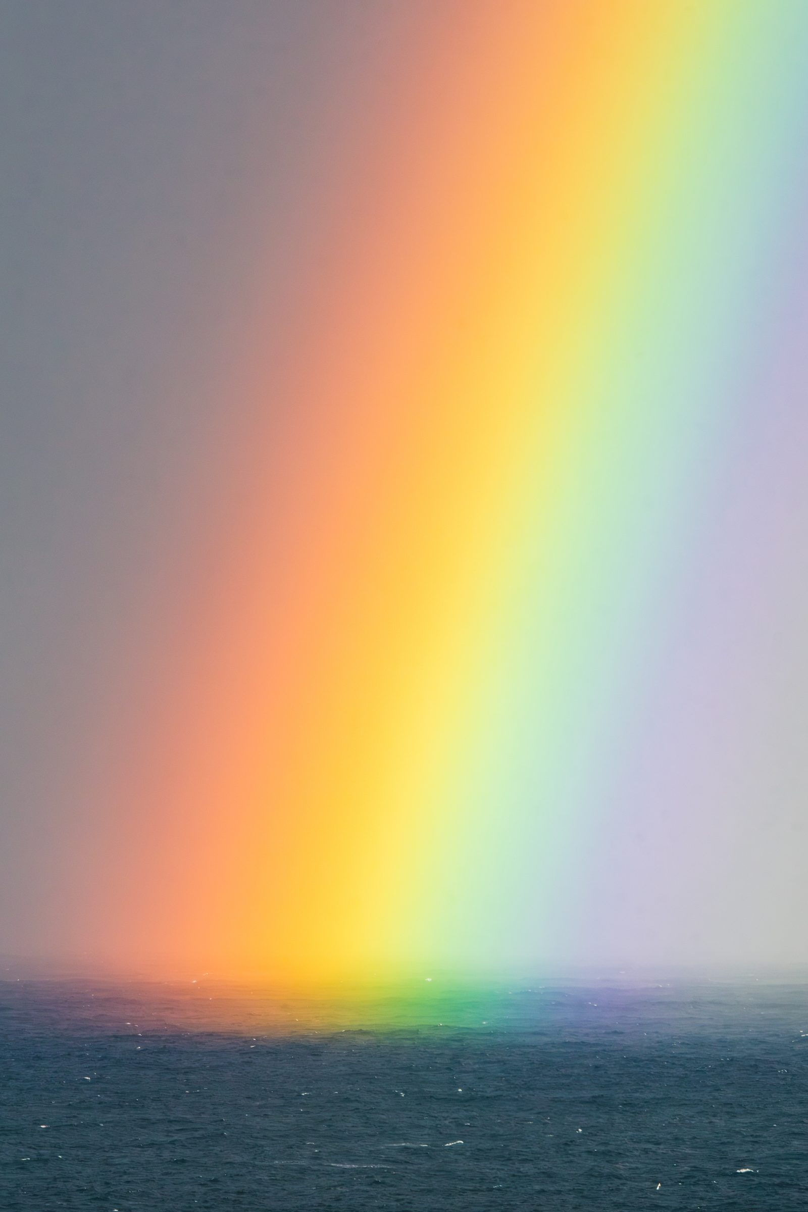 Where the ocean meets the sky, a rainbow bridges the distance between us, reminding me that love always finds its way home.